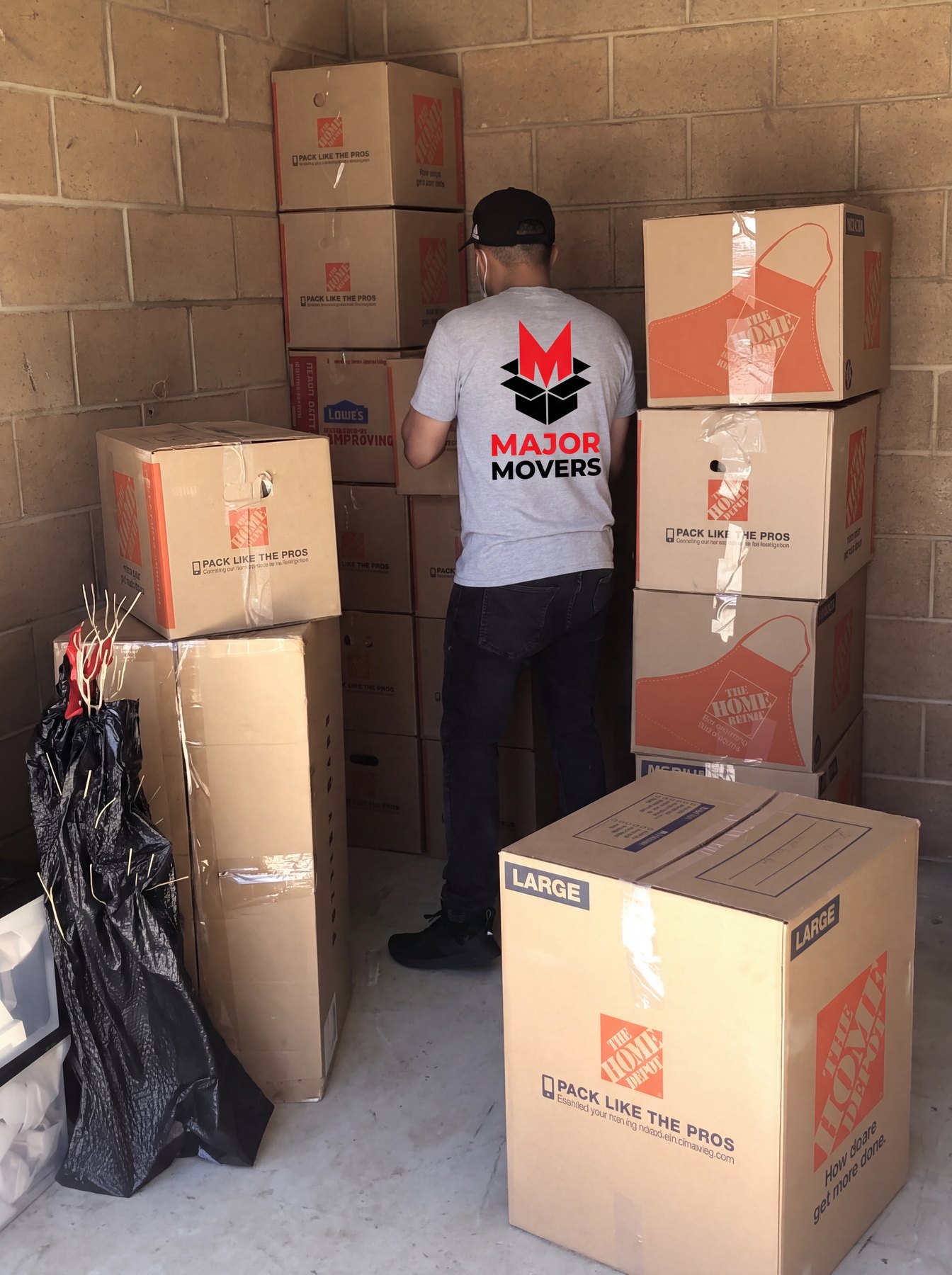 Packed boxes stacked against a wall during a clear-out